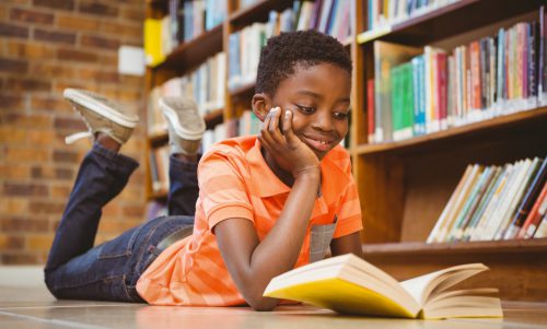 young african american boy reading